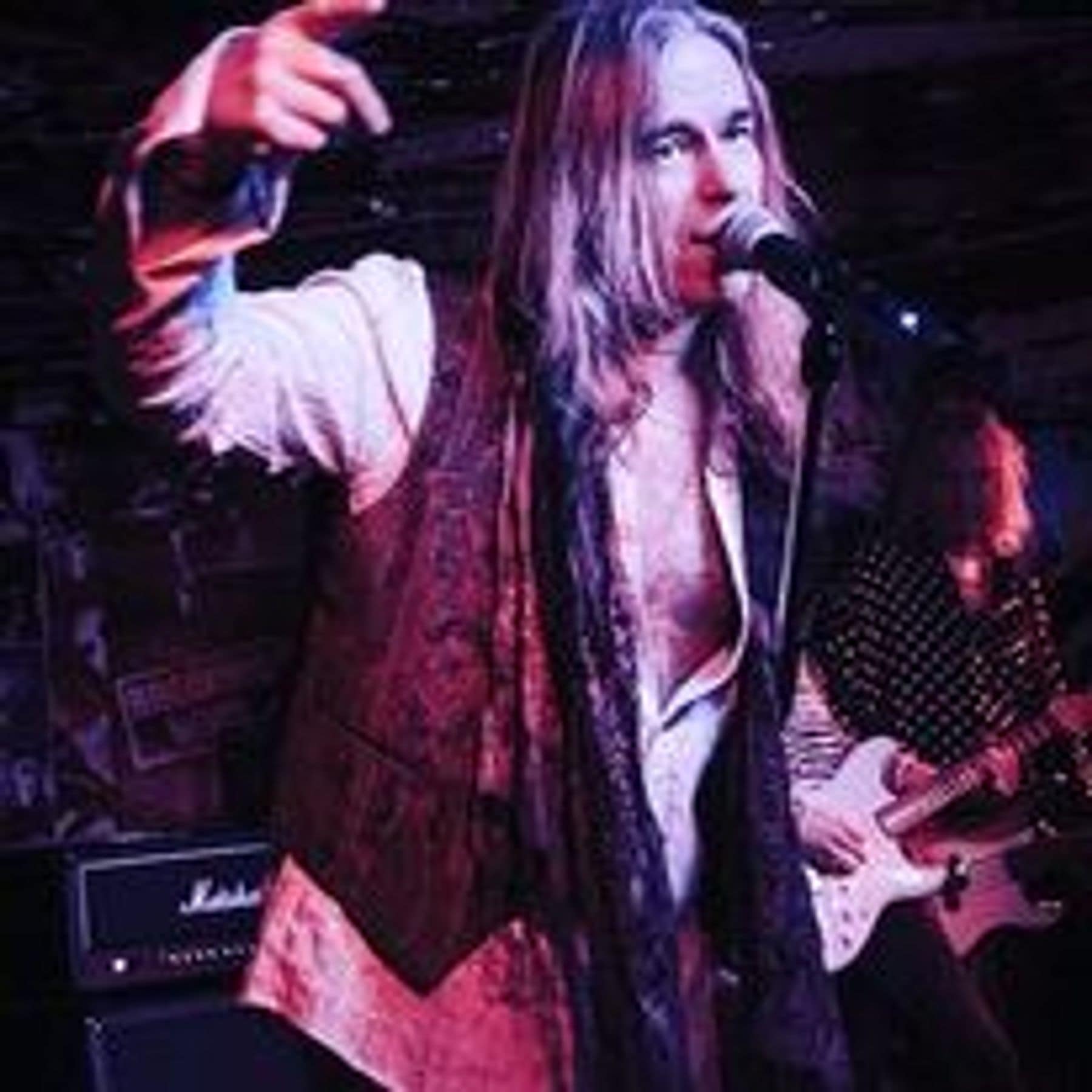 Brian Bee Frank pointing to the crowd mid-song